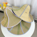 Stack of foldable woven straw sun hats