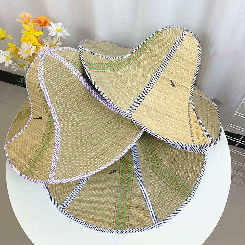 Stack of foldable woven straw sun hats